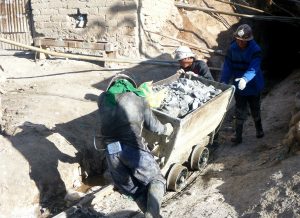 Manpower pushing rocks out of the mine Potosi Bolivia