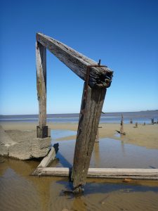 Decayed pier on a deserted beach Colonia Uruguay