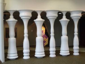 Do you see the columns, or the men?