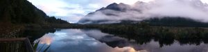 Mirror lake reflection of the fiordland mountains