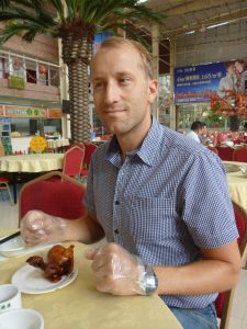 Olly contemplates the little chicken