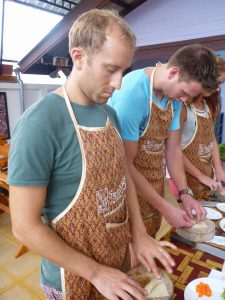 Rolling a spring roll Thai cookery