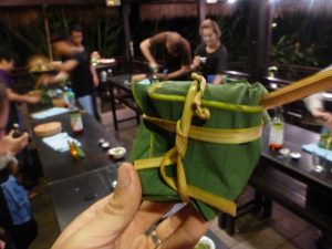 Olly personalises his banana leaf package Laos cuisine