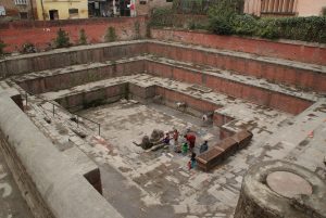 Locals washing in a dried-up water reserve