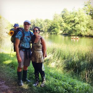 Family of three on a river stroll Wilderness